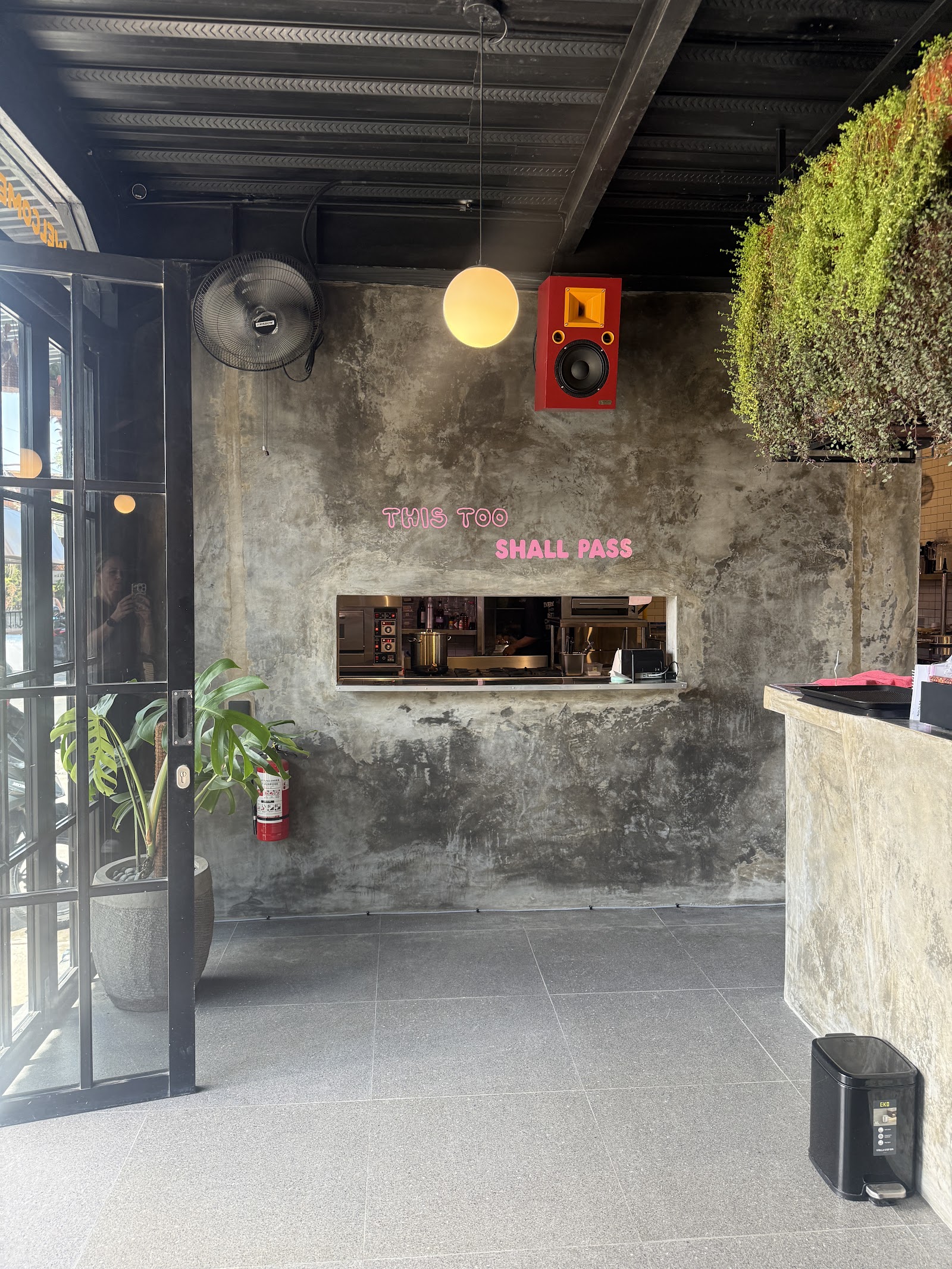 The Dog House Bali cafe interior in Canggu with neon sign